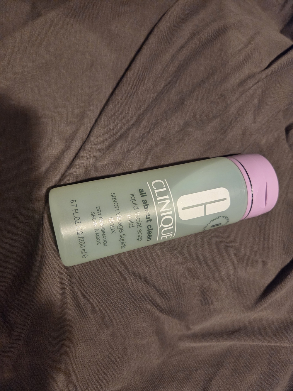 Clinique green bottle with pink cap hair conditioner